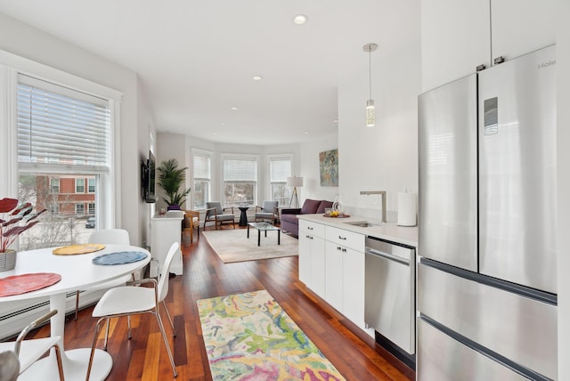 125 Morning St Unit 3/6, Portland, ME 04101 - kitchen with white cabinetry, recessed lighting, appliances with stainless steel finishes, a sink, and dark wood-style floors