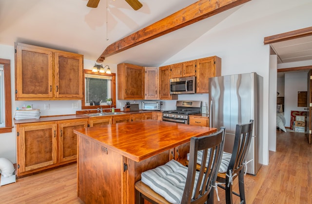 4 Tabert Ln, Belgrade, ME 04917 - kitchen with appliances with stainless steel finishes, a sink, light wood-style floors, brown cabinets, and butcher block counters