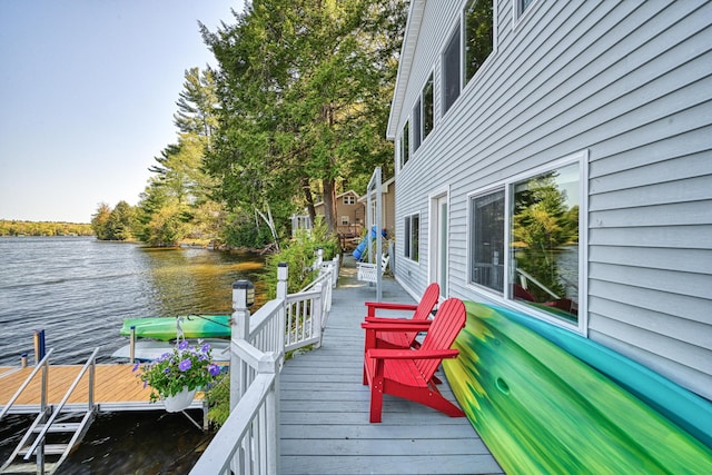 4 Tabert Ln, Belgrade, ME 04917 - wooden deck with a water view and a dock