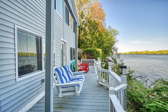 4 Tabert Ln, Belgrade, ME 04917 - wooden terrace with a water view