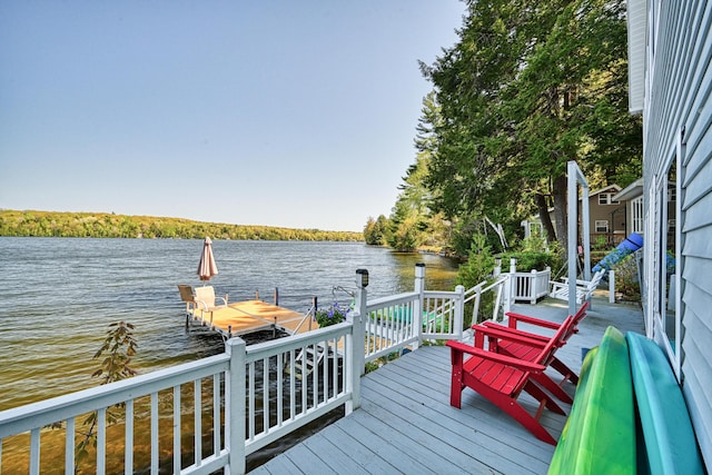 4 Tabert Ln, Belgrade, ME 04917 - wooden deck featuring a water view and a boat dock