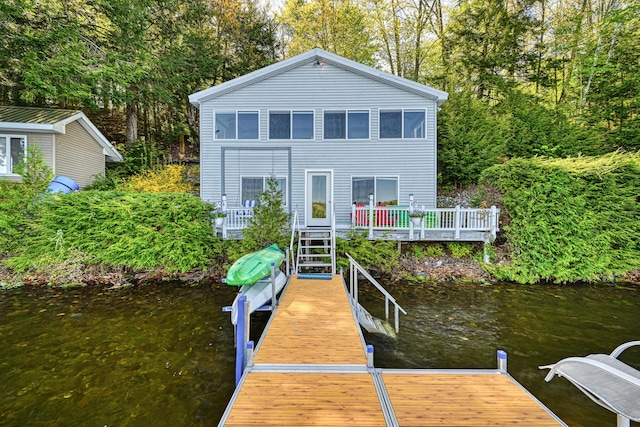 4 Tabert Ln, Belgrade, ME 04917 - dock area with a water view and view of scattered trees