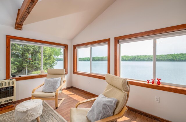 4 Tabert Ln, Belgrade, ME 04917 - sunroom / solarium with heating unit, vaulted ceiling, and a water view