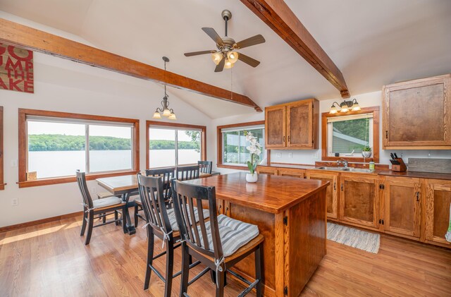 4 Tabert Ln, Belgrade, ME 04917 - kitchen featuring light wood-style floors, brown cabinets, hanging light fixtures, and ceiling fan