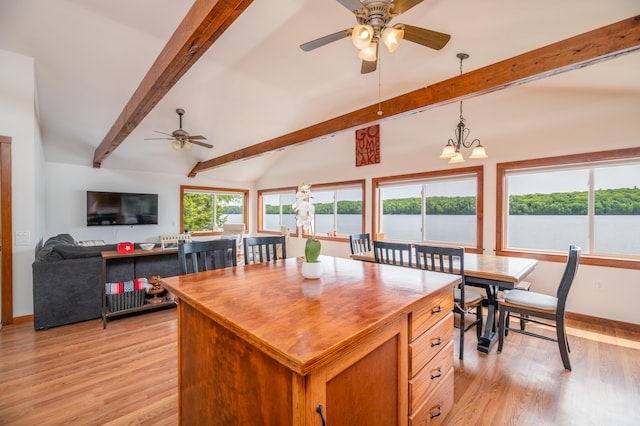 4 Tabert Ln, Belgrade, ME 04917 - kitchen featuring ceiling fan, light wood-style floors, wooden counters, decorative light fixtures, and a center island