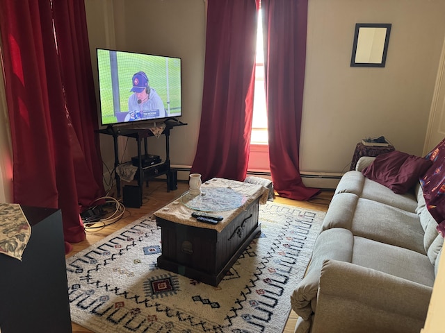 6 Spring St, Waterville, ME 04901 - living room featuring wood finished floors, a baseboard heating unit, and baseboard heating