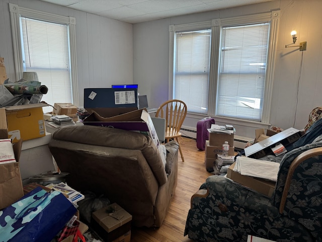 6 Spring St, Waterville, ME 04901 - living room featuring light wood-style floors and a baseboard heating unit