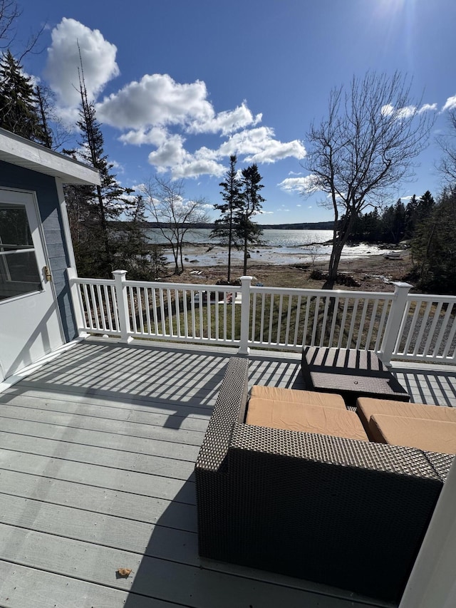 deck featuring a water view