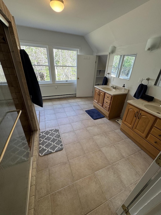 full bath featuring lofted ceiling, a sink, and plenty of natural light