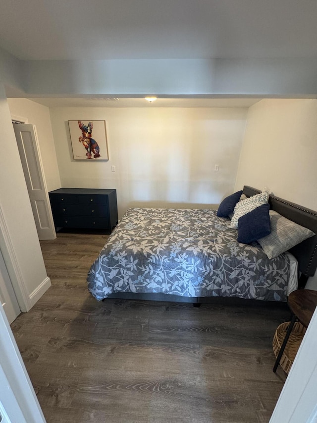 bedroom featuring wood finished floors