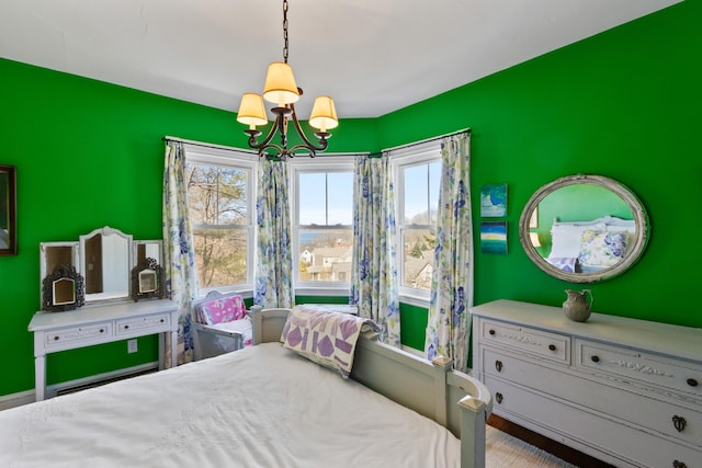 bedroom featuring a notable chandelier