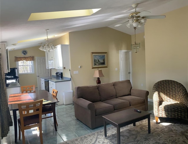 22 Ocean Park Rd Unit 136, Saco, ME 04072 - living room with a ceiling fan, light tile patterned floors, and vaulted ceiling with skylight