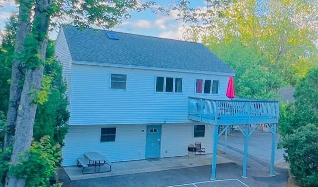 22 Ocean Park Rd Unit 136, Saco, ME 04072 - back of house with a wooden deck, a patio area, and a shingled roof