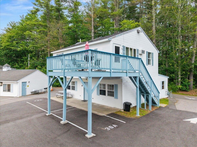 22 Ocean Park Rd Unit 136, Saco, ME 04072 - view of front of home with a deck, stairs, and uncovered parking