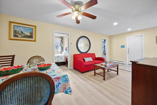 22 Ocean Park Rd Unit 136, Saco, ME 04072 - living room featuring a baseboard radiator, ceiling fan, recessed lighting, and light wood-type flooring