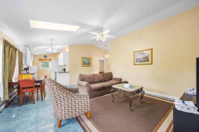 22 Ocean Park Rd Unit 136, Saco, ME 04072 - living room featuring a skylight, lofted ceiling, ceiling fan, a chandelier, and tile patterned floors