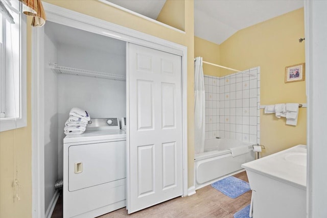 22 Ocean Park Rd Unit 136, Saco, ME 04072 - full bathroom with washer / dryer, shower / tub combo with curtain, vanity, wood finished floors, and vaulted ceiling