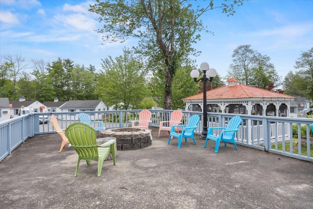 22 Ocean Park Rd Unit 136, Saco, ME 04072 - view of patio / terrace with a gazebo, a fire pit, and view of scattered trees