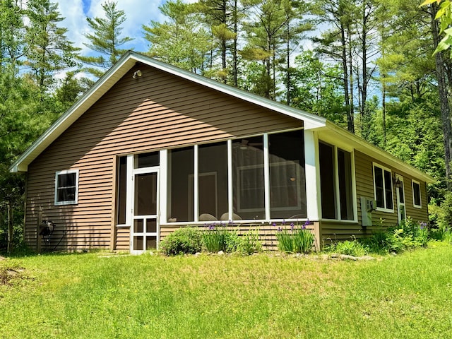 52 Main Rd, Chesterville, ME 04938 - back of house with a sunroom and a lawn