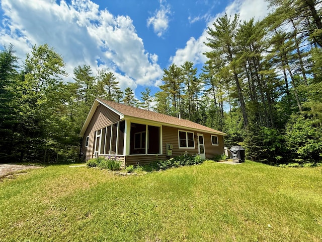 52 Main Rd, Chesterville, ME 04938 - view of front of home with a sunroom and a front lawn