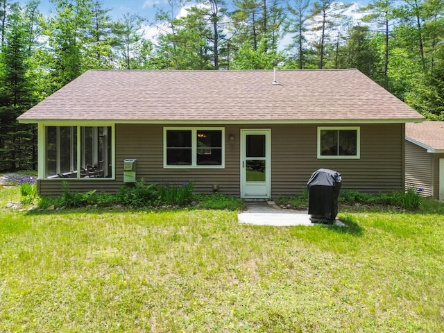 52 Main Rd, Chesterville, ME 04938 - rear view of house featuring a shingled roof, a yard, and a patio area