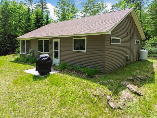 52 Main Rd, Chesterville, ME 04938 - rear view of house featuring a shingled roof and a yard