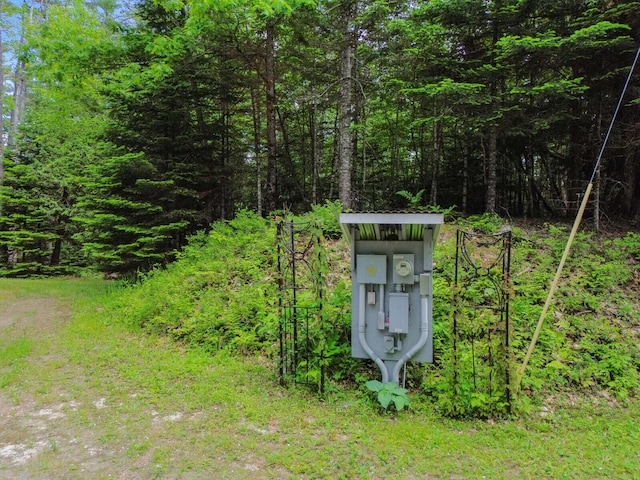52 Main Rd, Chesterville, ME 04938 - exterior view of electric meter and a heavily wooded area