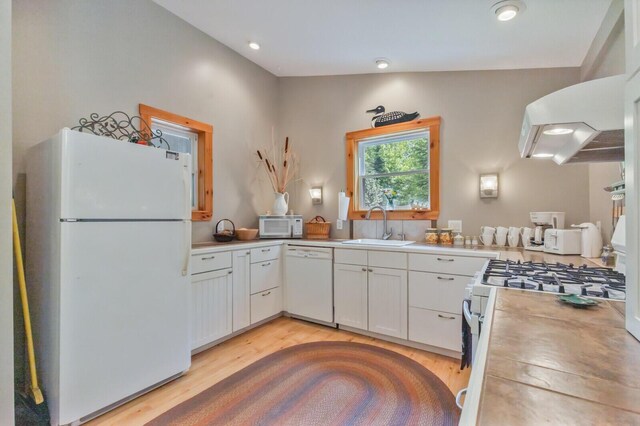 52 Main Rd, Chesterville, ME 04938 - kitchen with white appliances, light wood finished floors, white cabinets, light countertops, and recessed lighting