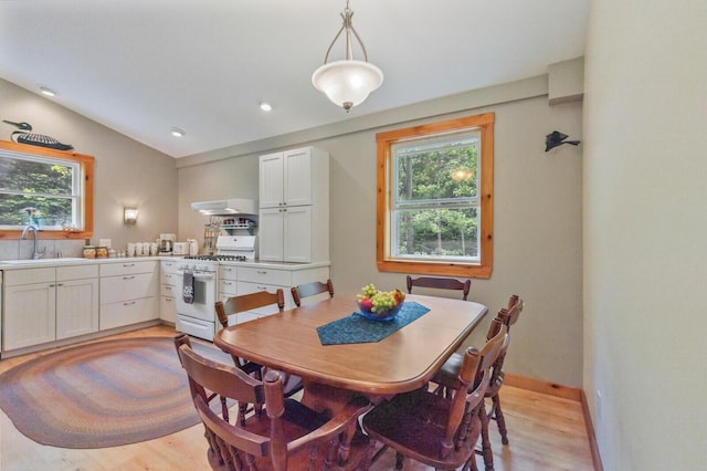 52 Main Rd, Chesterville, ME 04938 - dining room featuring healthy amount of natural light, light wood-type flooring, vaulted ceiling, and recessed lighting