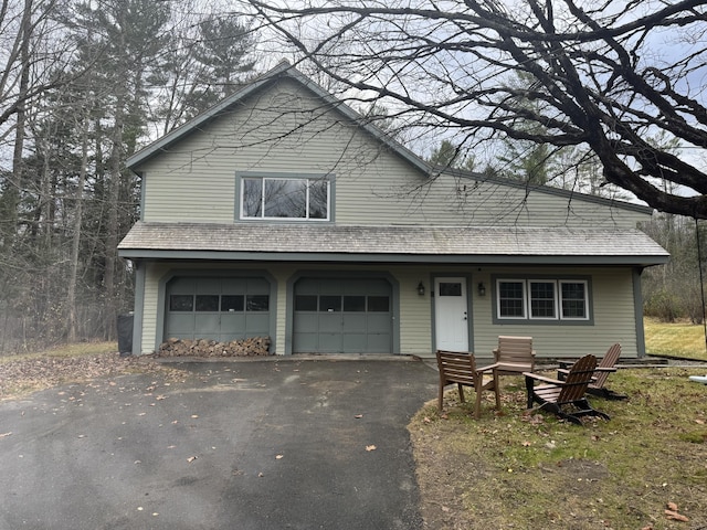 2 Mountain View Ln, Readfield, ME 04355 - view of front of house with driveway, a garage, and roof with shingles