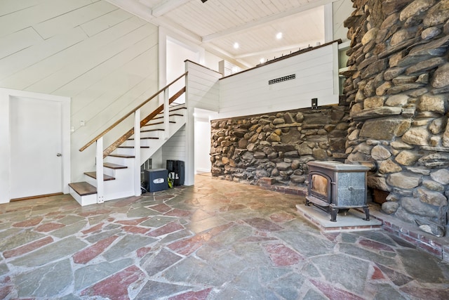 2 Mountain View Ln, Readfield, ME 04355 - unfurnished living room with stairs, wooden ceiling, beam ceiling, a high ceiling, and stone flooring