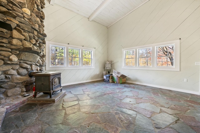 2 Mountain View Ln, Readfield, ME 04355 - interior space with high vaulted ceiling, baseboards, beam ceiling, a wood stove, and wooden ceiling
