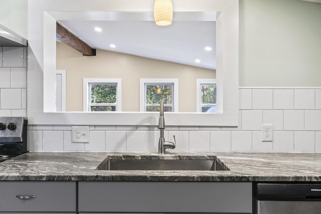 2 Mountain View Ln, Readfield, ME 04355 - kitchen featuring vaulted ceiling, gray cabinetry, stainless steel dishwasher, dark stone counters, and a sink