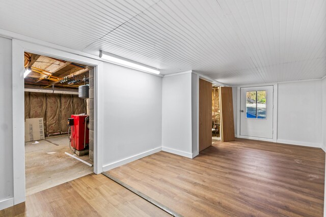 2 Mountain View Ln, Readfield, ME 04355 - below grade area with baseboards, wood finished floors, and a heating unit