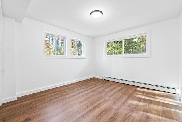 2 Mountain View Ln, Readfield, ME 04355 - unfurnished room with a baseboard radiator, baseboards, and wood finished floors