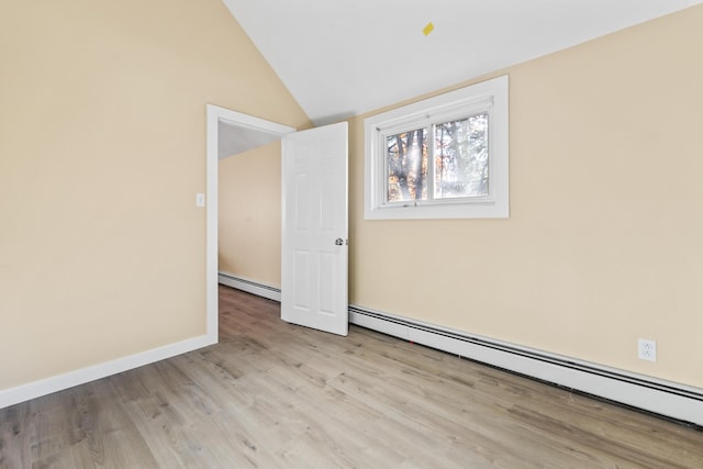 2 Mountain View Ln, Readfield, ME 04355 - unfurnished room with baseboards, baseboard heating, wood finished floors, and lofted ceiling