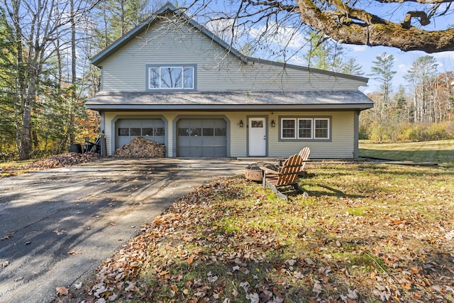 2 Mountain View Ln, Readfield, ME 04355 - view of front facade with aphalt driveway, a garage, and a front yard