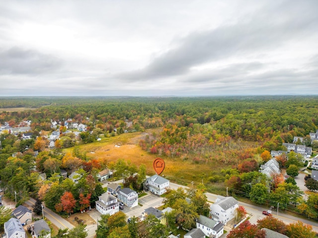 birds eye view of property with a forest view and a residential view