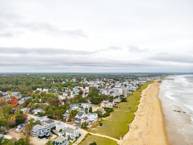 bird's eye view featuring a view of the beach and a water view