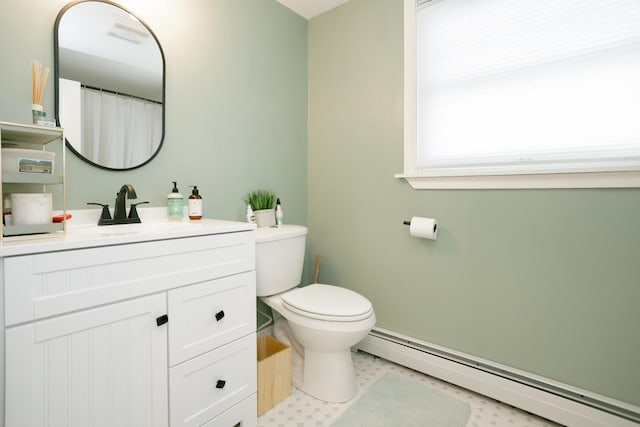 full bathroom featuring toilet, tile patterned floors, a baseboard heating unit, and vanity