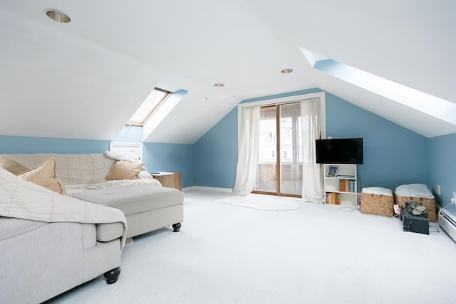 interior space with vaulted ceiling with skylight, baseboards, and carpet