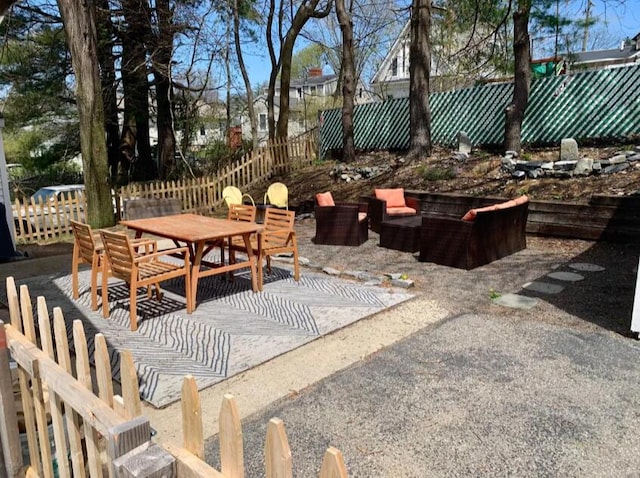 view of patio / terrace featuring outdoor dining area and fence