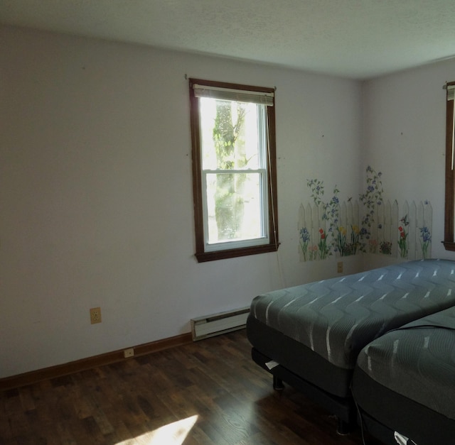 365 Country Club 3rd Rd, Sanford, ME 04073 - bedroom with baseboard heating, wood finished floors, and baseboards