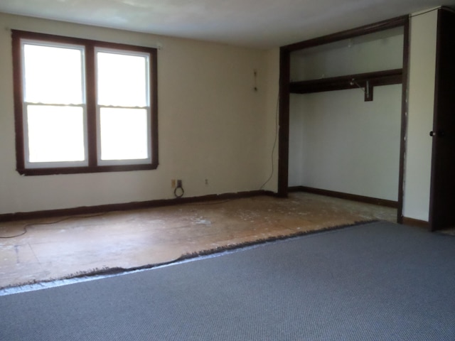365 Country Club 3rd Rd, Sanford, ME 04073 - unfurnished bedroom with multiple windows, baseboards, and carpet floors