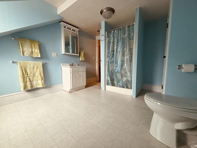 20 Water St, Winterport, ME 04496 - bathroom with vanity, lofted ceiling, toilet, a shower with shower curtain, and tile patterned floors