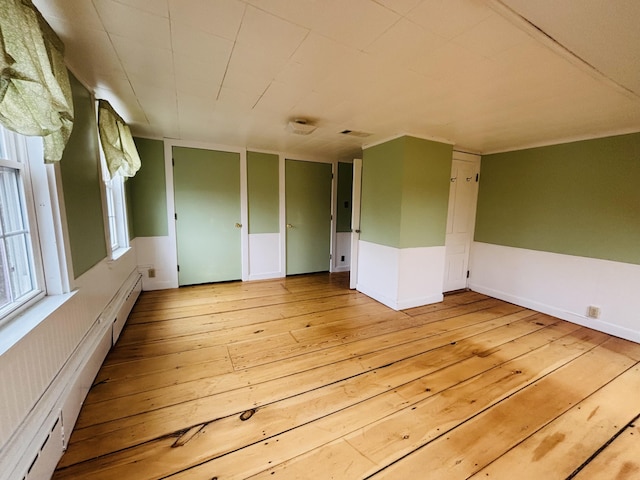 20 Water St, Winterport, ME 04496 - spare room with baseboard heating, light wood-style floors, a baseboard heating unit, and visible vents
