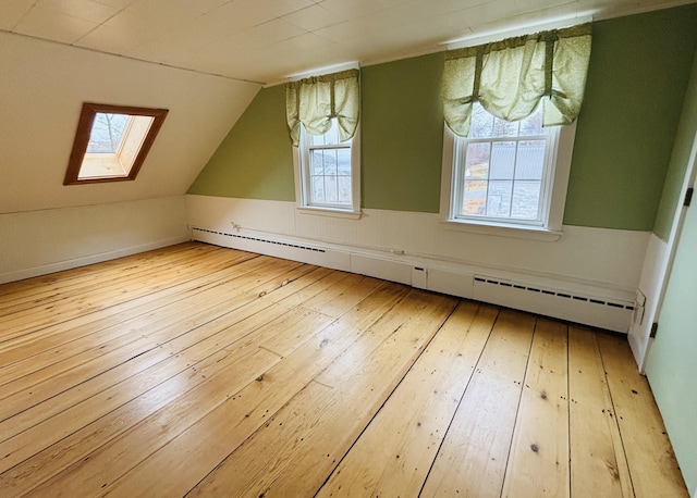 20 Water St, Winterport, ME 04496 - bonus room featuring baseboard heating, lofted ceiling with skylight, and wood-type flooring