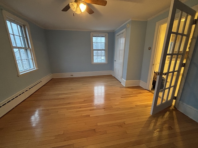 20 Water St, Winterport, ME 04496 - unfurnished room with baseboards, ceiling fan, crown molding, and wood-type flooring