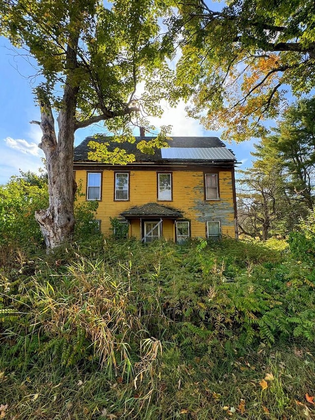 view of front of property featuring a chimney