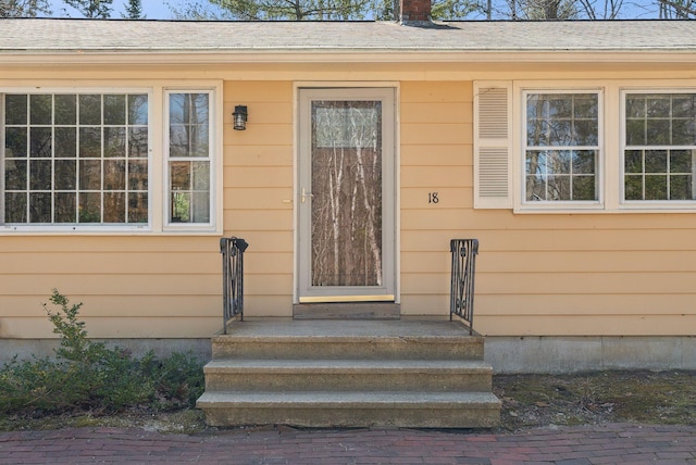 property entrance with a chimney